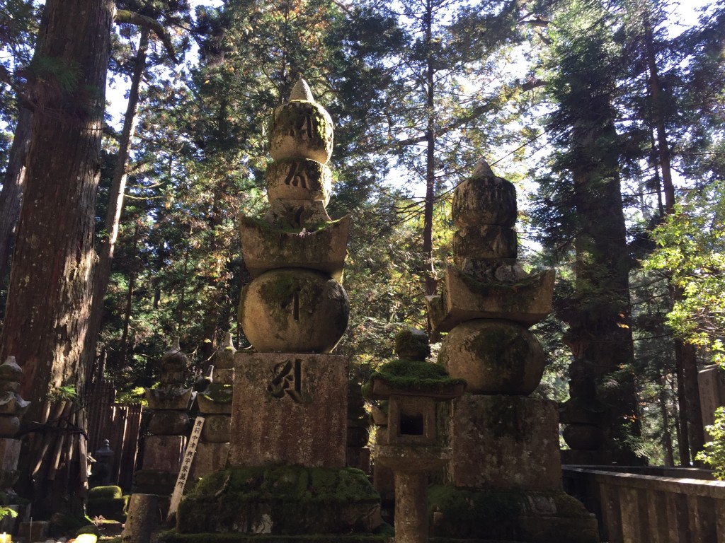 These different parts of small Buddhist pagodas known as Gorinto in the cemetery that are said to represent the Five Elements including water, air, earth, fire, and energy, or void
