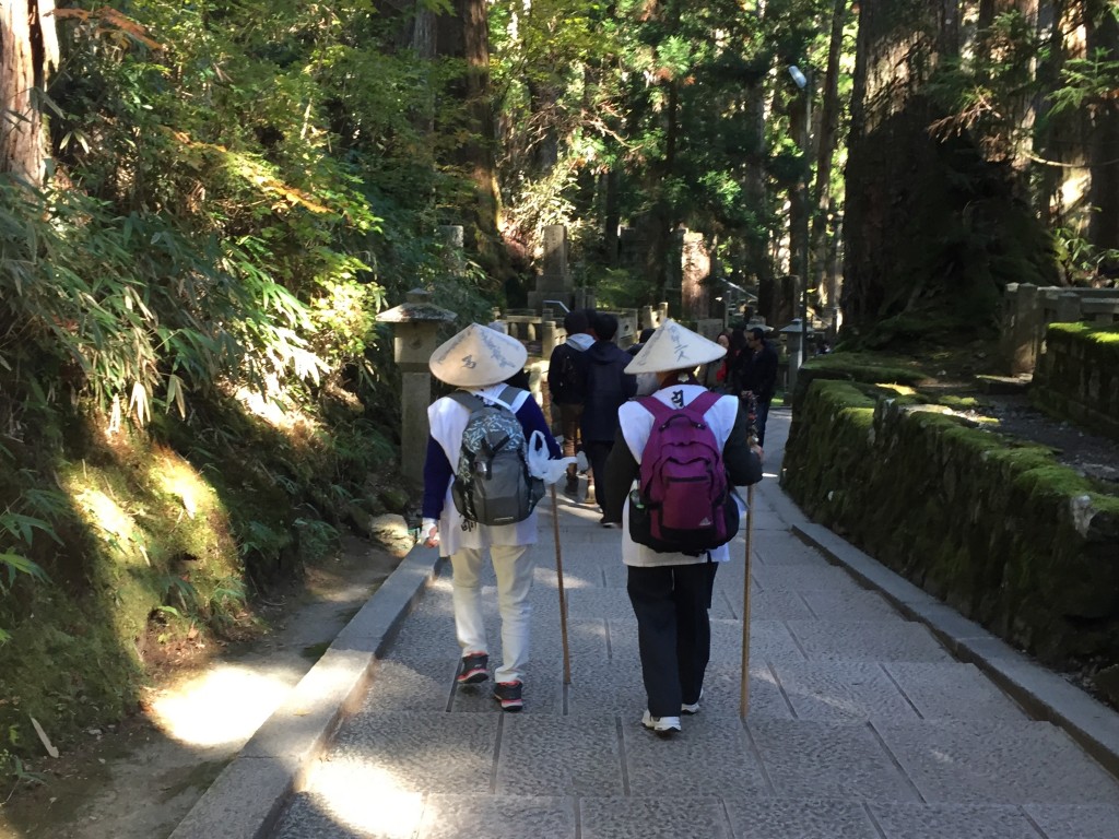 Mt. Koya is part of a World-Heritage honored path followed by Buddhist pilgrims for over a thousand years. There were many pilgrims in Okunoin likely finishing or starting their journeys.