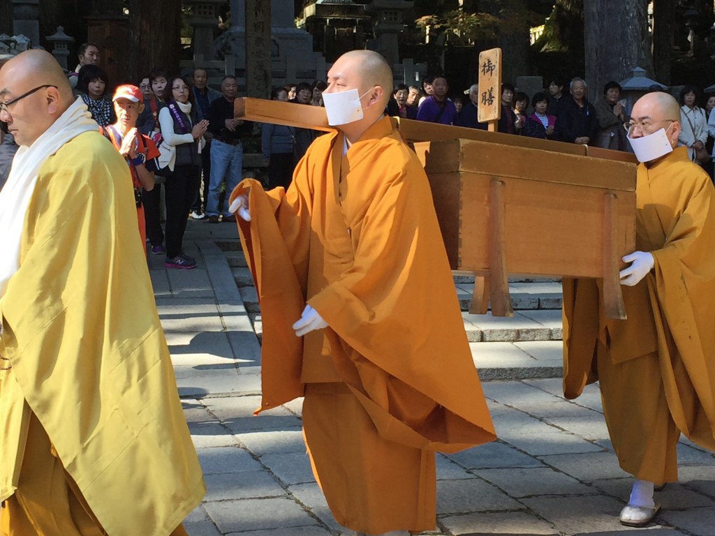 Monks preparing food for Kobo Daishi, who is fed directly by the head monk twice a day