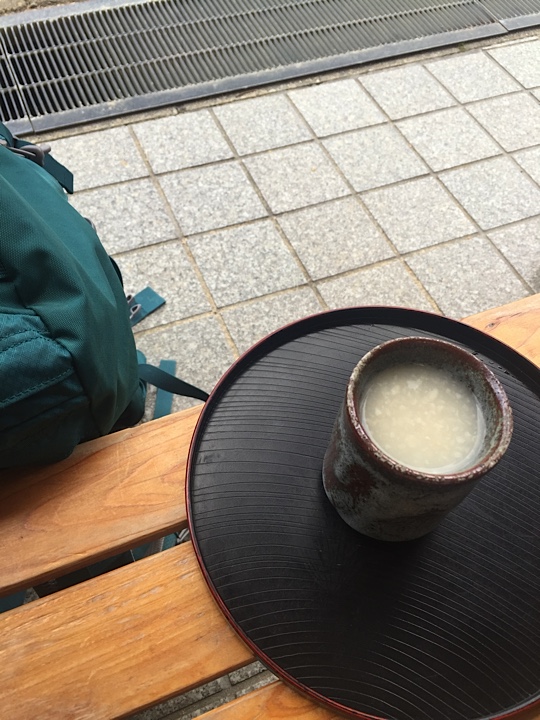 A traditional fermented rice drink called "amazake" to celebrate finishing the trail