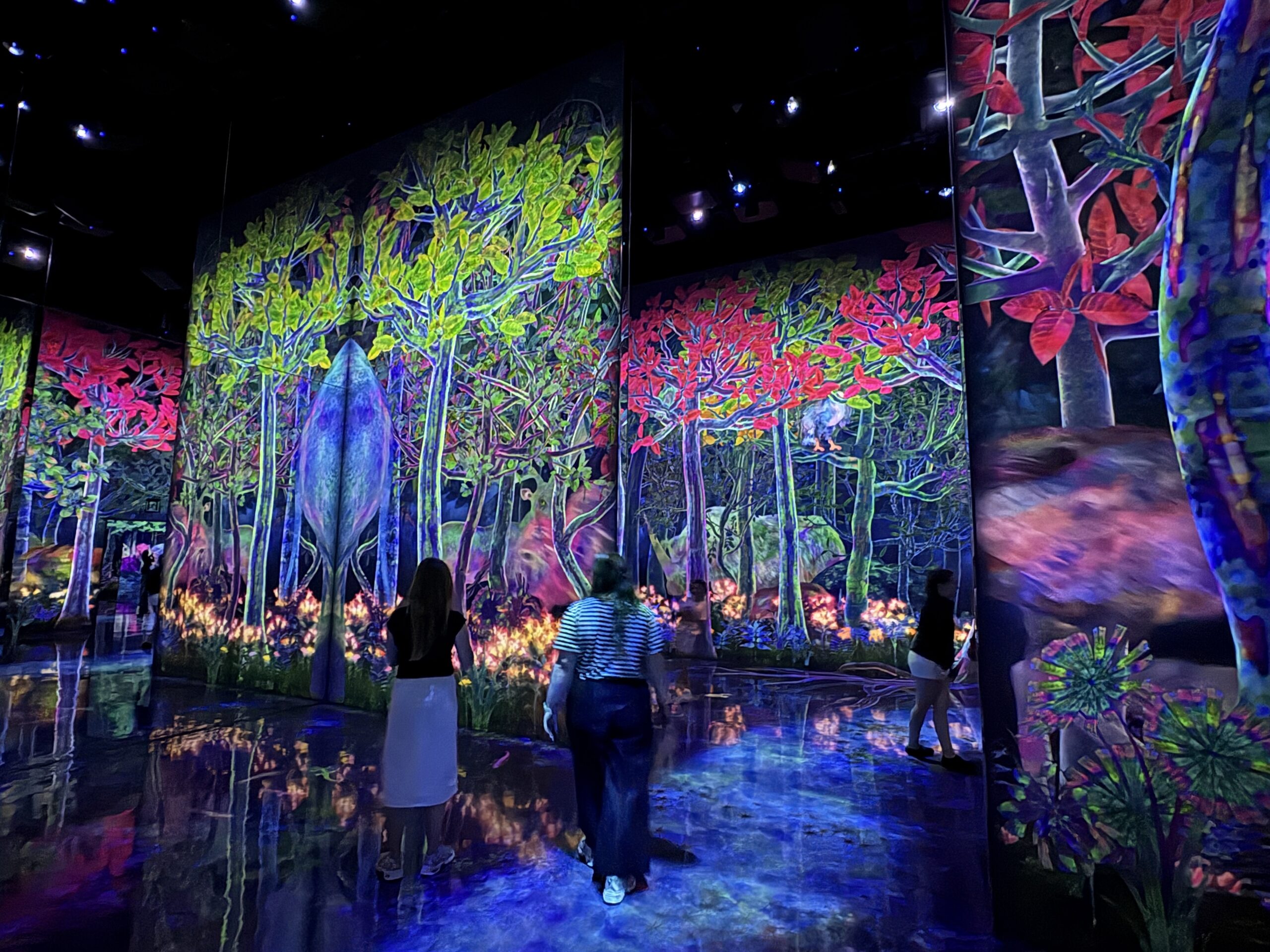 Colorful digital forest installation in Catching and Collecting Extinct Forest at teamLab Planets Tokyo